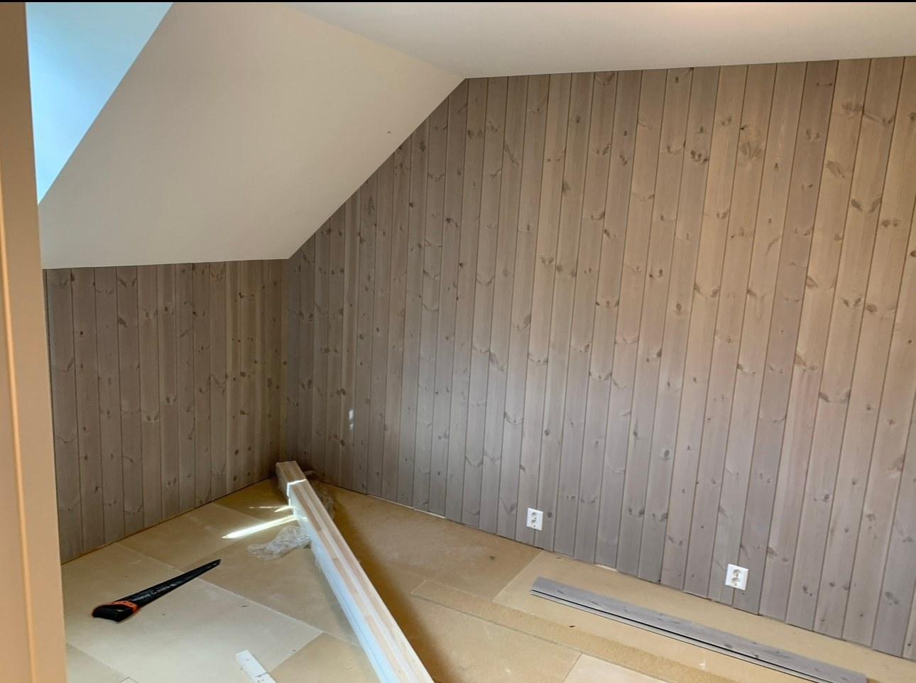 An attic room newly panelled in wood