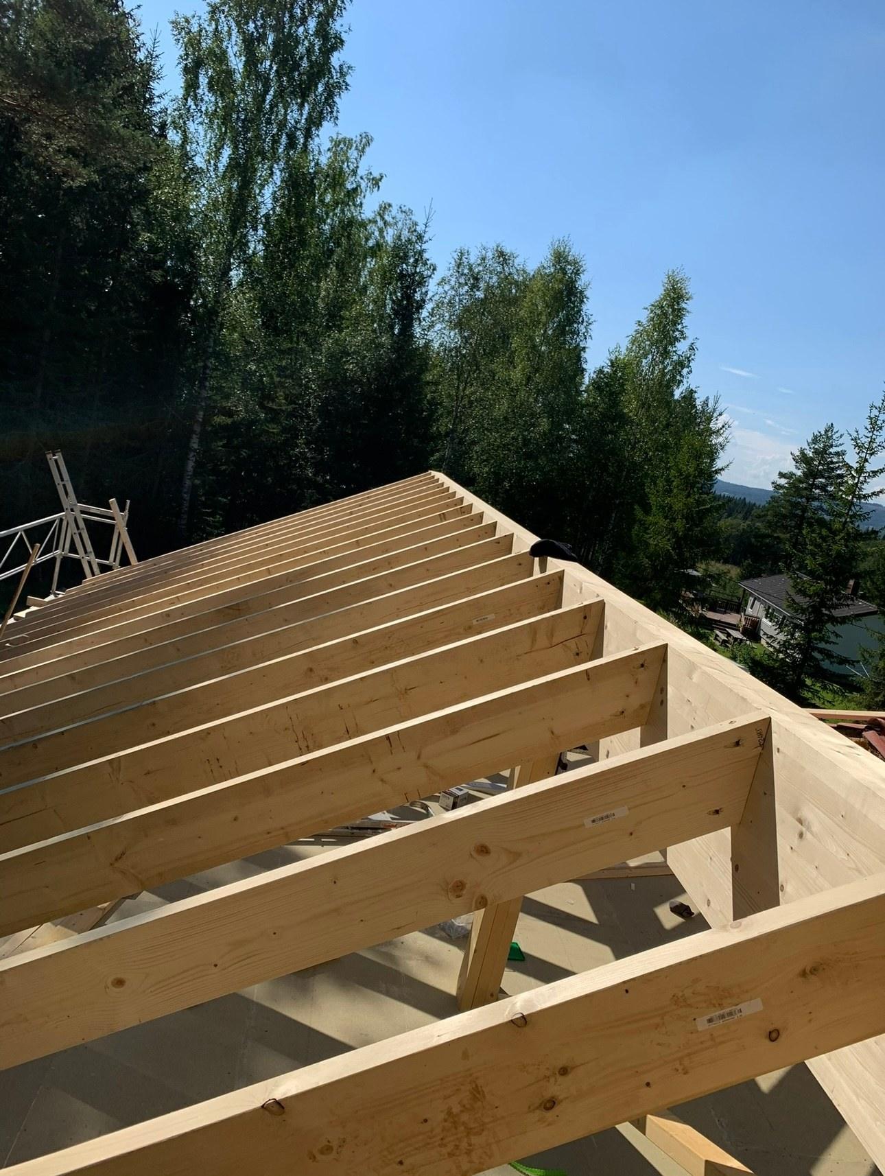 New roof rafters against a blue sky